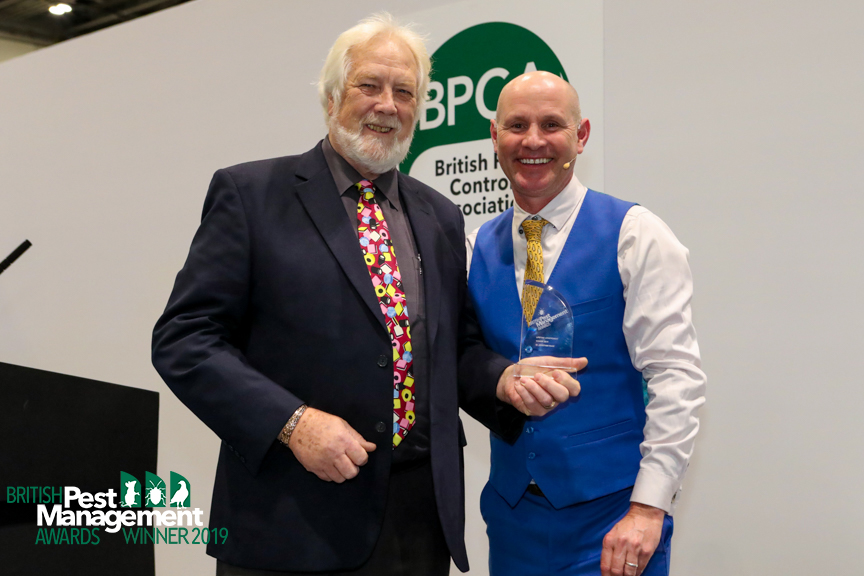 JO collecting his Award Dr Wade getting his award from television ecologist, Mike Dilger